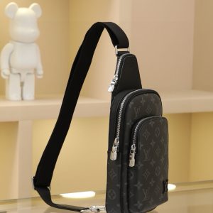 Alternative view of This Avenue small shoulder bag features Monogram Eclipse coated canvas, exploring the trend of crossbody styling through its refined silhouette. The main compartment's interior pocket ensures secure storage, while the zippered exterior pocket offers easy access to everyday essentials. A triangular zippered pocket is positioned where the shoulder strap meets the bag. 33x16x5.7cm